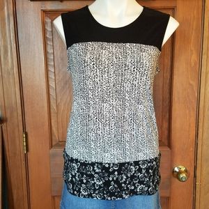 A Dress Barn black and white sleeveless blouse.
